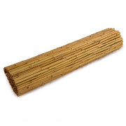 natural bamboo cane fence installed for decorative garden screening